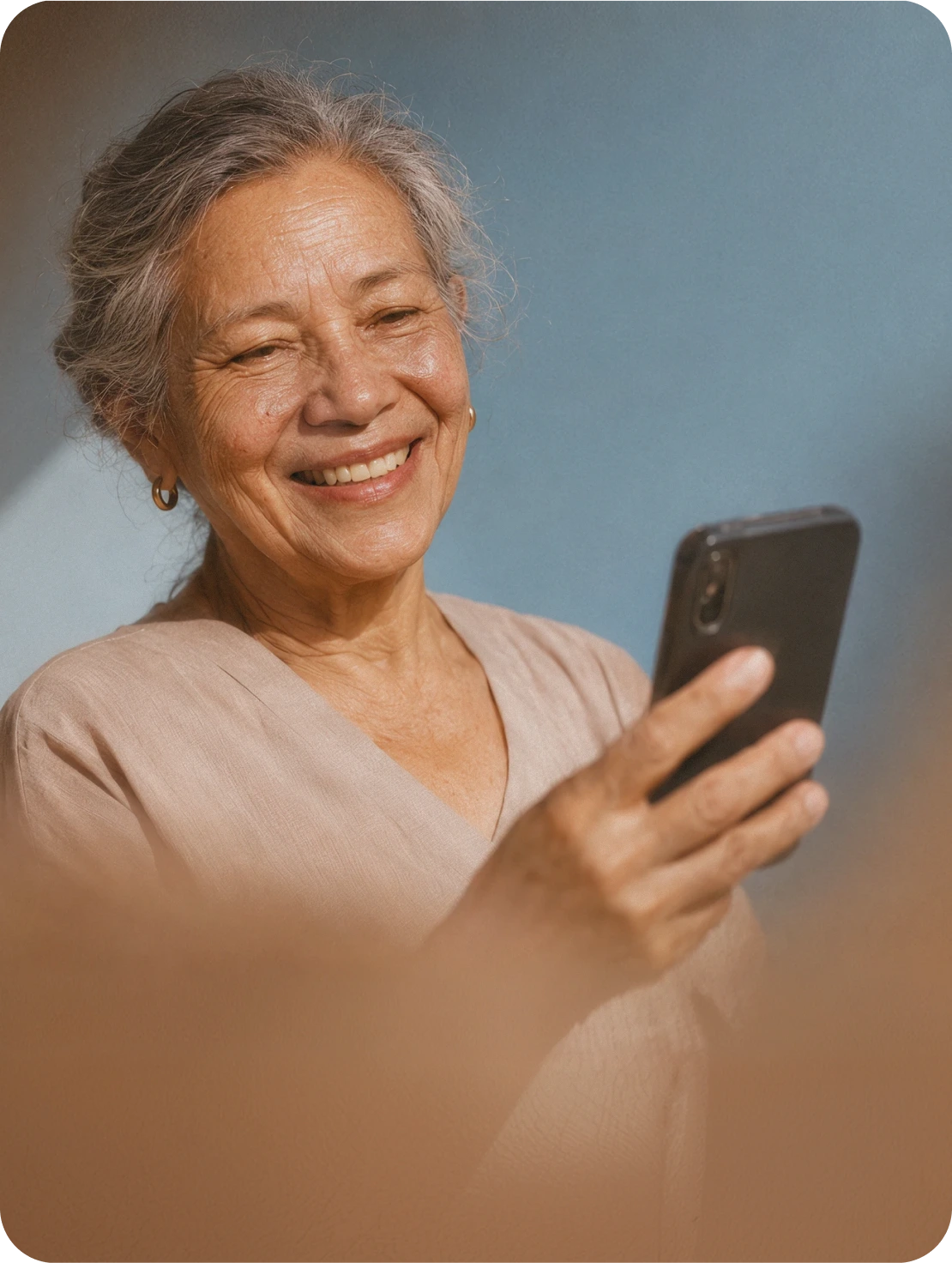 An older woman talking on the phone