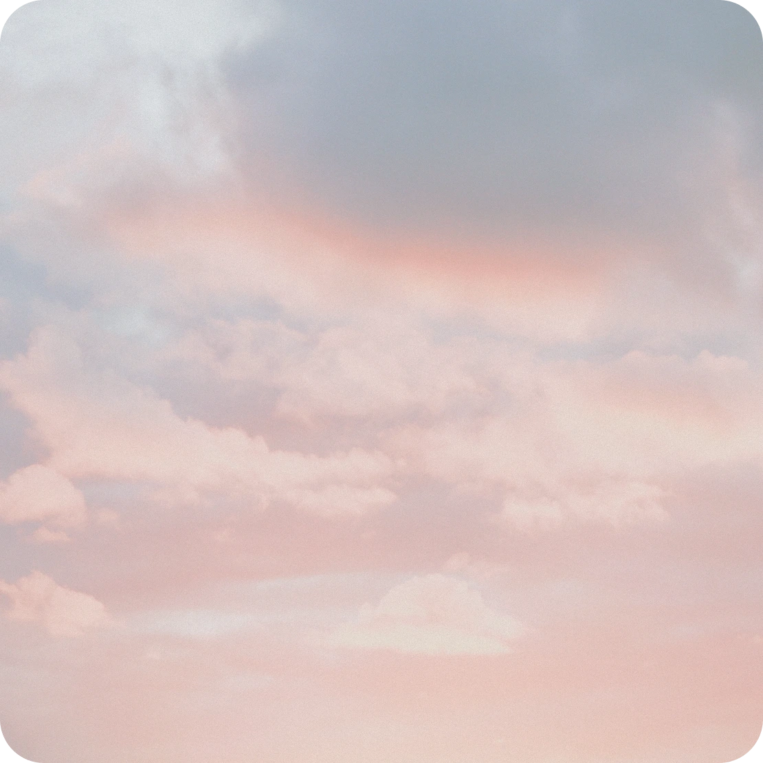Soft pink clouds at altitude