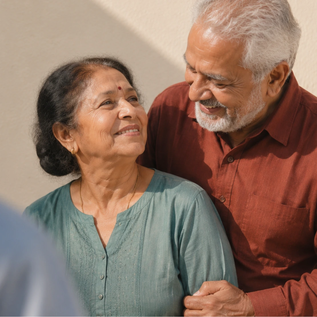 An older couple sitting together at home